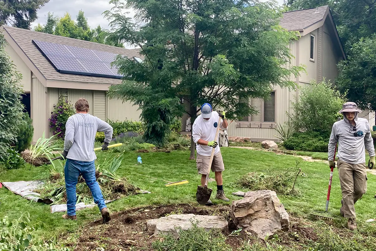 Blue Spruce Horticulture team members installing landscaping