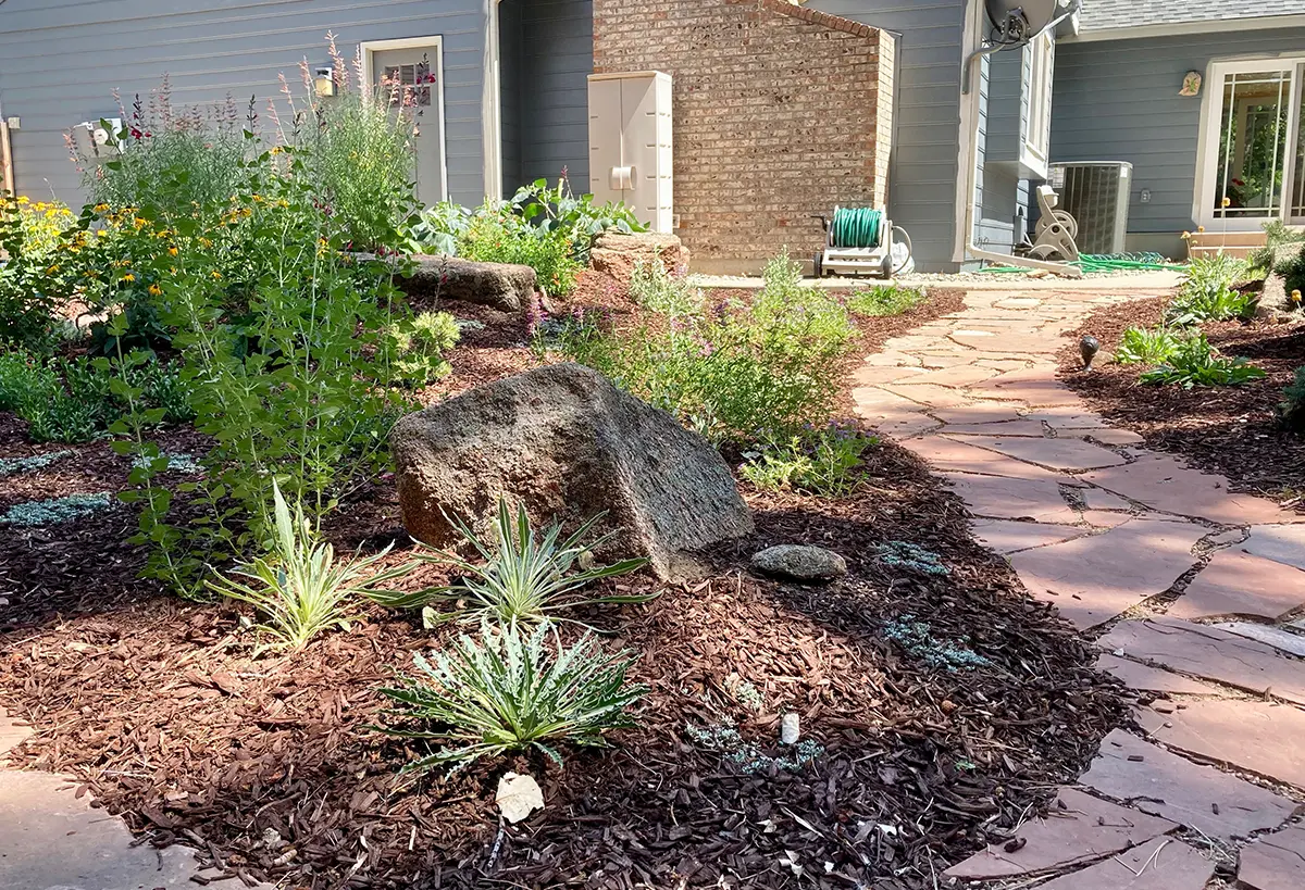 The Blue Spruce Horticulture team transforming spaces with pathways, landscaping, and mulch