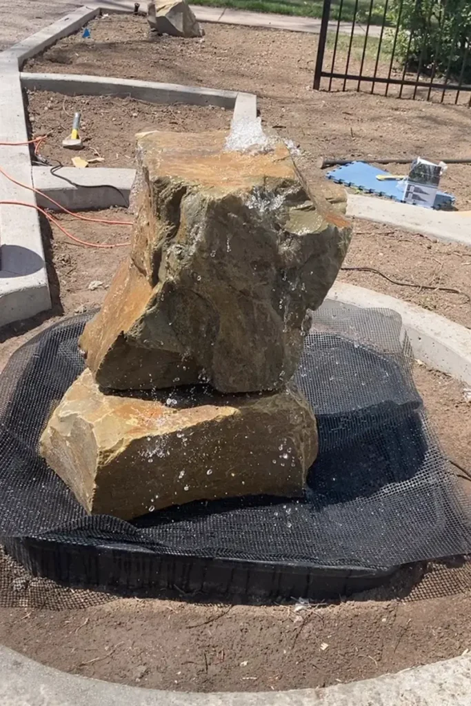 Boulder fountain installation by Blue Spruce Horticulture for The Nectary at Poudre Public Library