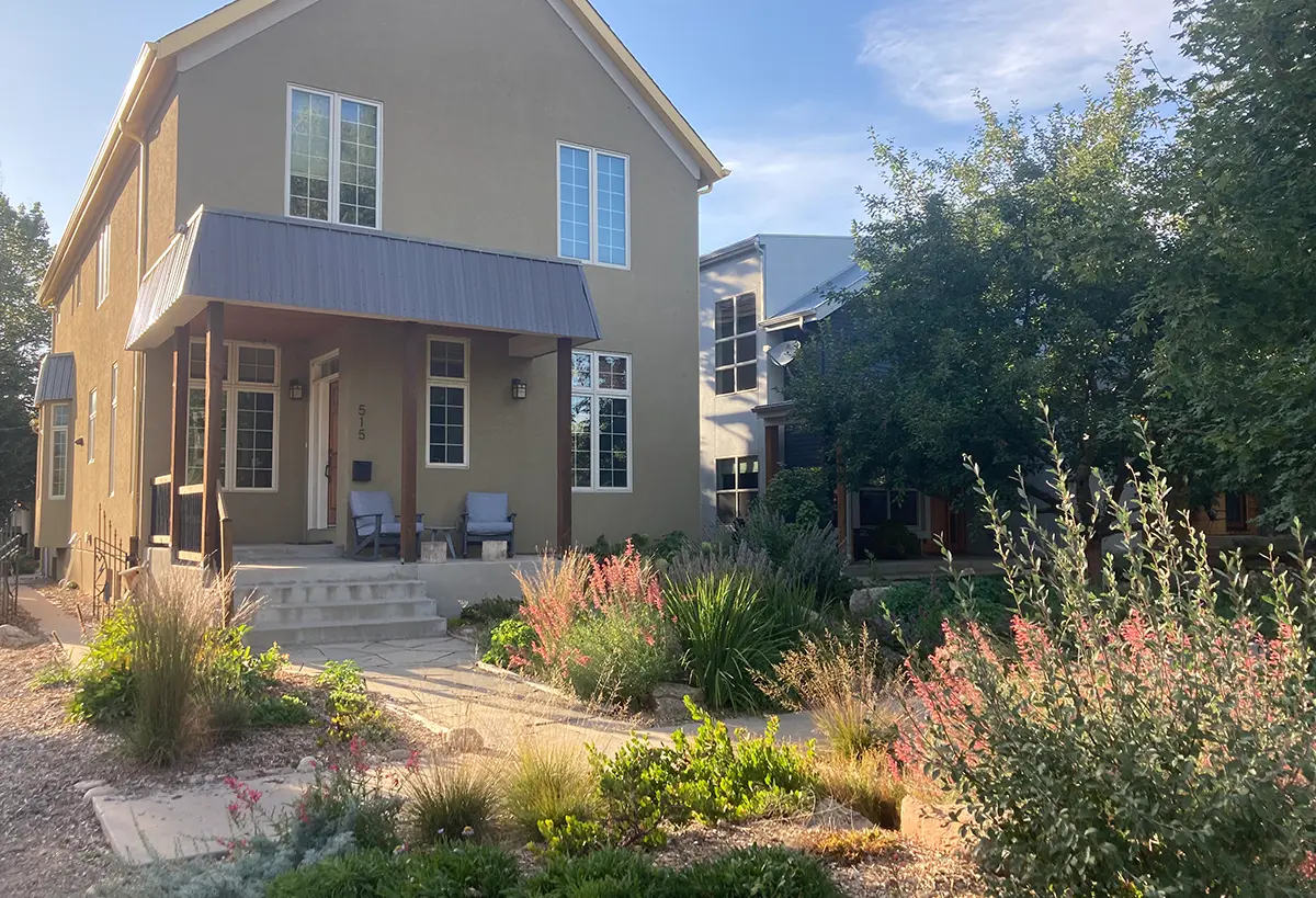 Whitcomb Street house in the fall season with autumn flowers blooming designed by Blue Spruce Horticulture.