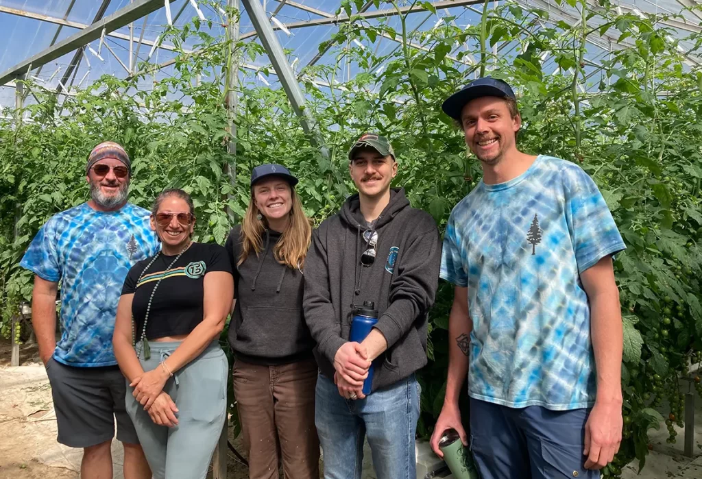 Blue Spruce Horticulture team in a green house