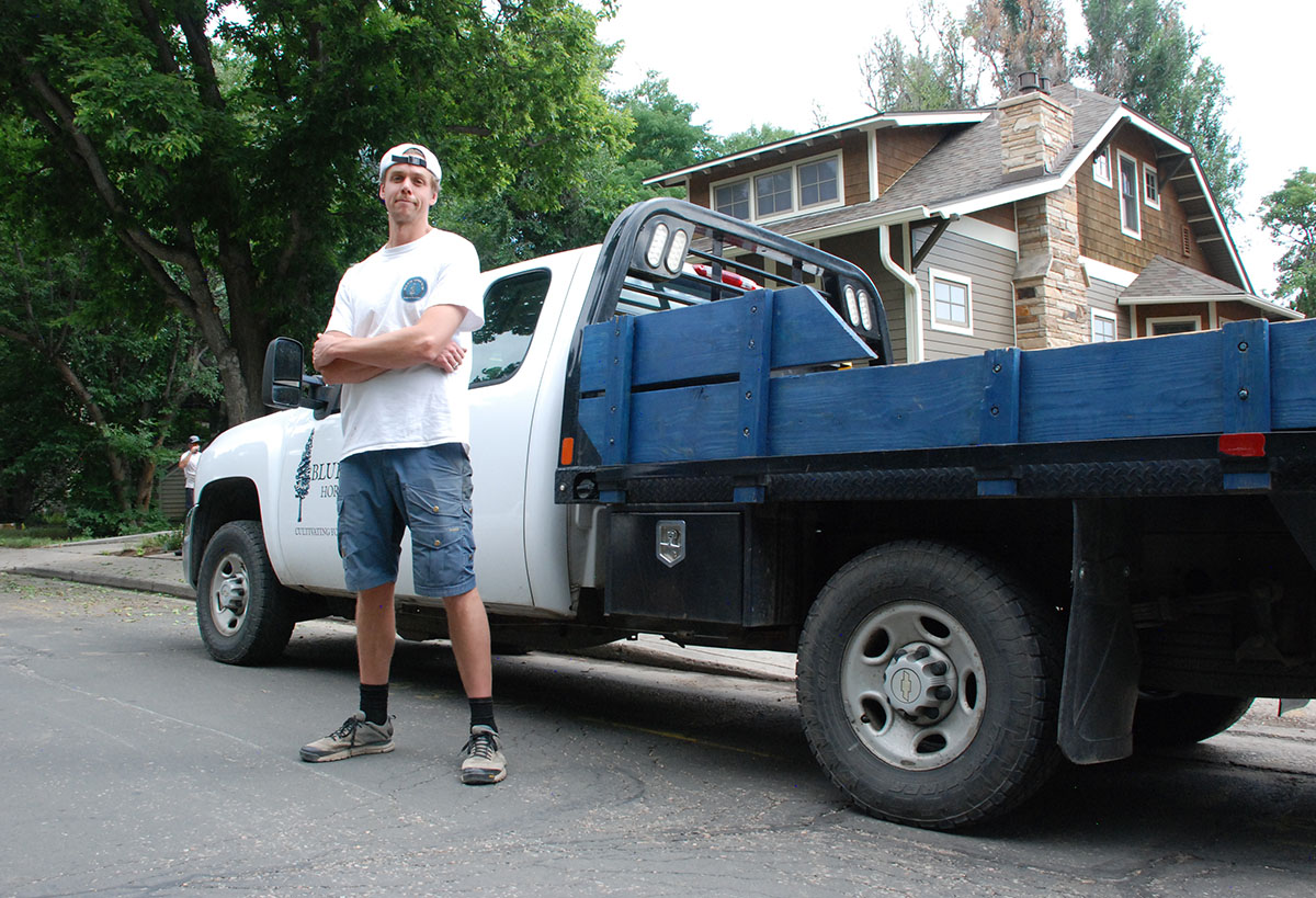 Stuart Shoemaker in front of a Blue Spruce Truck